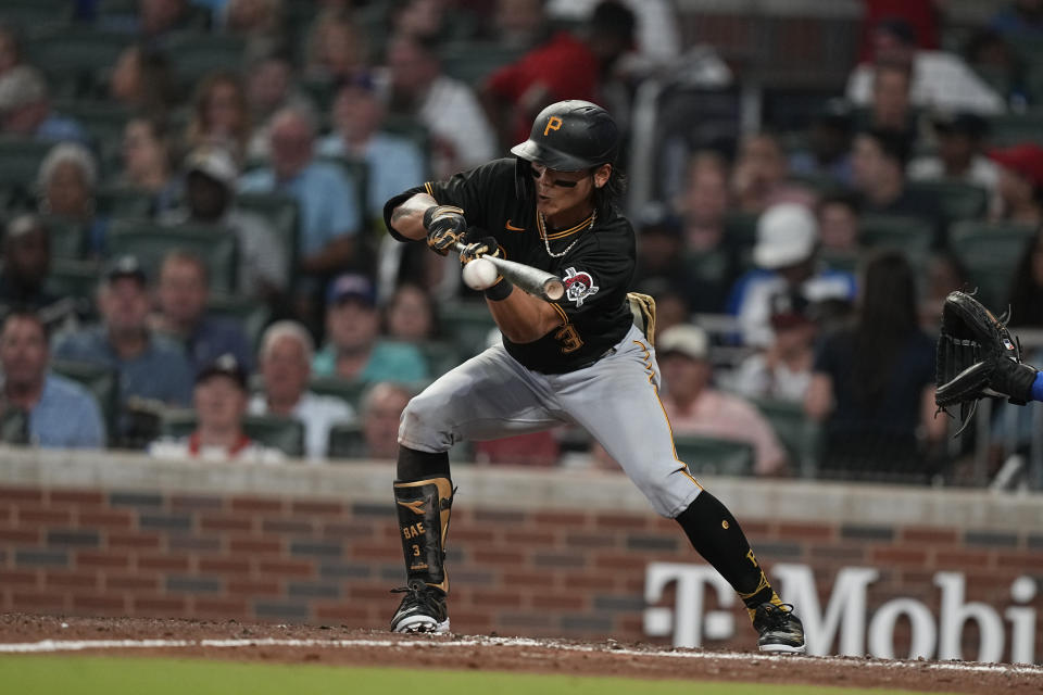 Pittsburgh Pirates' Ji Hwan Bae (3) bunts in the fourth inning of a baseball game against the Atlanta Braves, Saturday, Sept. 9, 2023, in Atlanta. (AP Photo/Brynn Anderson)