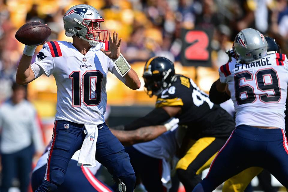 Patriots quarterback Mac Jones winds up to throw a pass during the third quarter of Sunday's game against the Steelers.