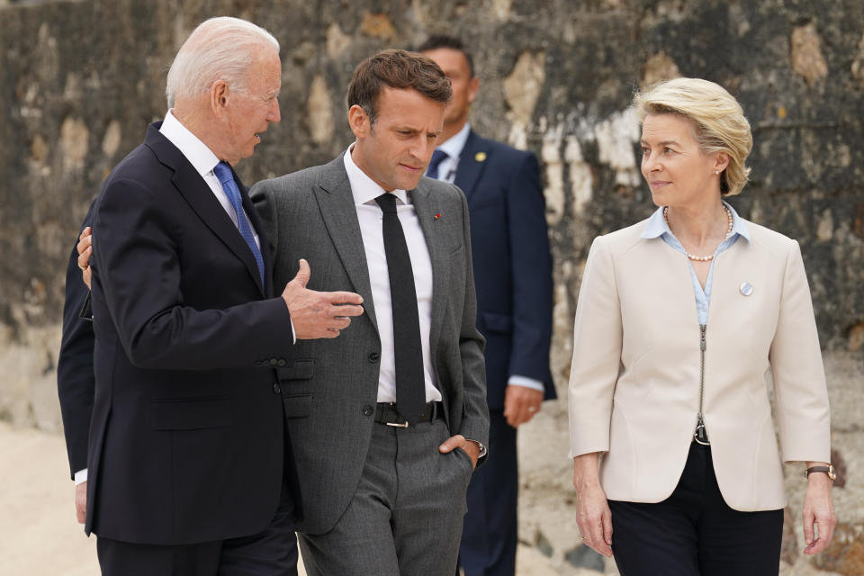 President Joe Biden speaks with French President Emmanuel Macron and European Commission President Ursula von der Leyen after posing for the G-7 family photo with guests at the G-7 summit, Friday, June 11, 2021, in Carbis Bay, England. (Kevin Lamarque/Pool via AP)