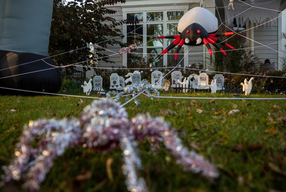 Halloween decorations cover the front yard of a home down the road from Pierce Elementary School in Birmingham on Tuesday, Oct. 24, 2023.