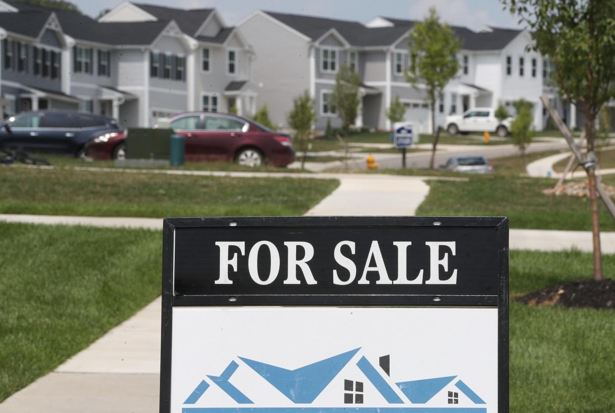 A for sale sign in front of a house in the Brookside Greens development in Norton.