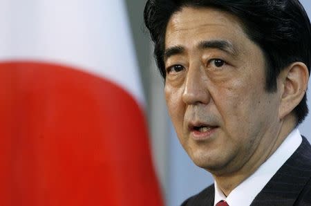 Japan's Prime Minister Shinzo Abe addresses a news conference following a meeting with German Chancellor Angela Merkel at the Chancellery in Berlin January 10, 2007. REUTERS/Arnd Wiegmann