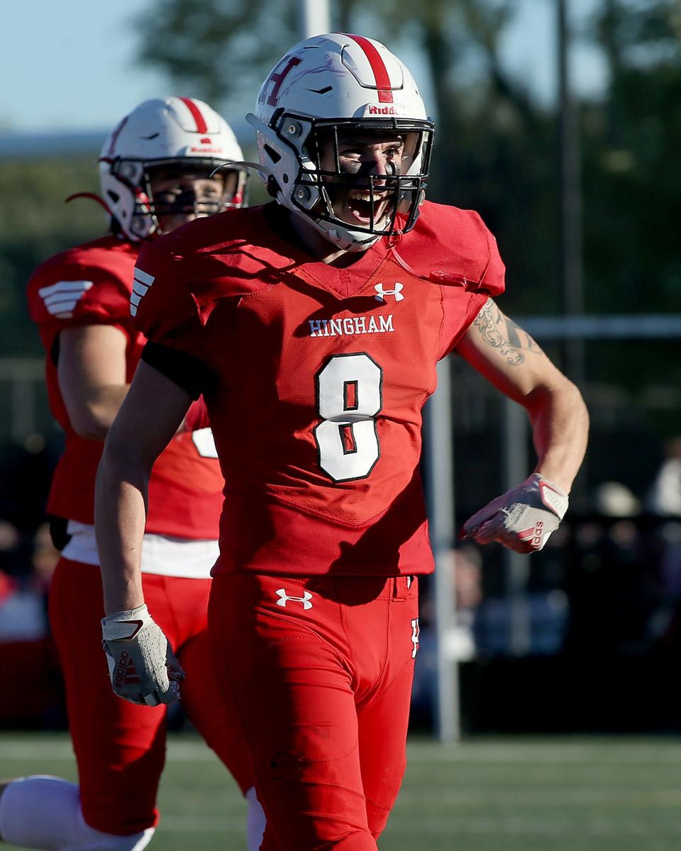 Hingham's Ronan O'Ciardubhain is all smiles while celebrating the interception made by Hingham’s Johnny Heffernan during third quarter action of their game against Weymouth at Hingham High on Saturday, Sept. 24, 2022. 