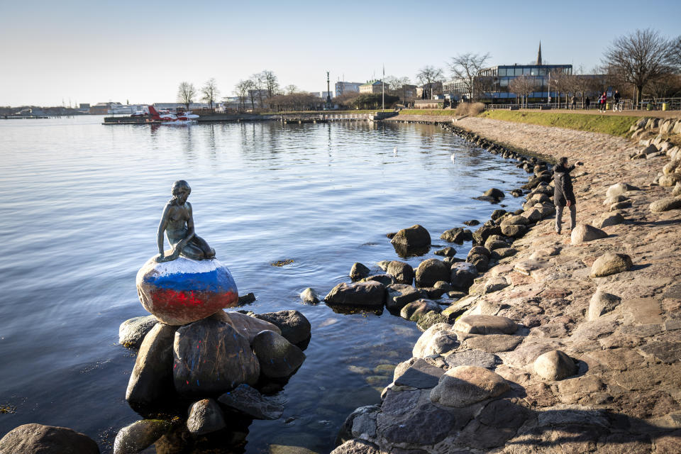 The Russian flag is painted on the stone where the Little Mermaid sits on, after the sculpture was vandalized, in Copenhagen, Denmark, Thursday, March 2, 2023. (Ida Marie Odgaard/Ritzau Scanpix via AP)