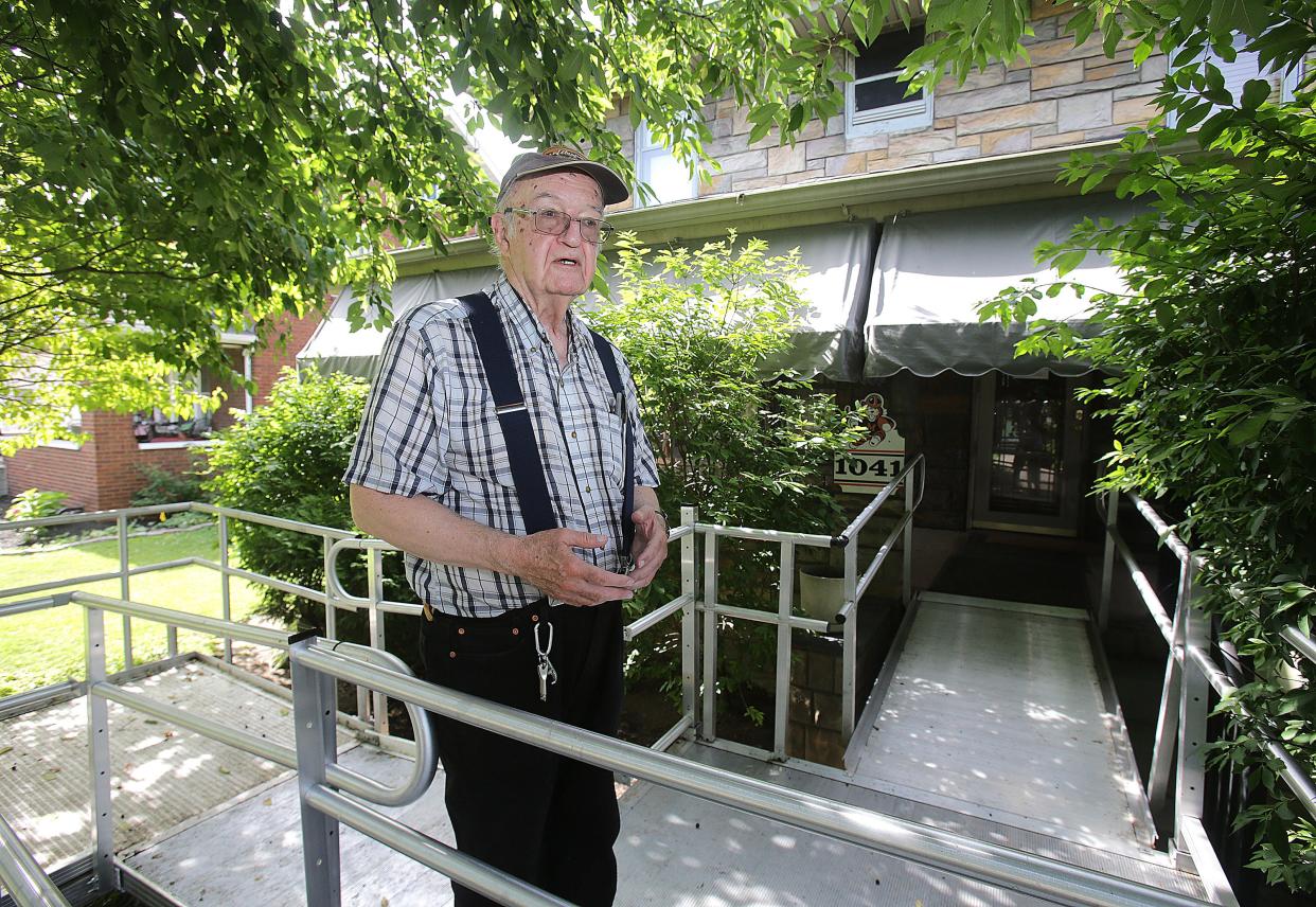 Massillon resident George Helmreich talks about what a godsend the new aluminum wheelchair ramp installed by Hammer & Nails has been to help his wife, Jerri, access their northeast side home.