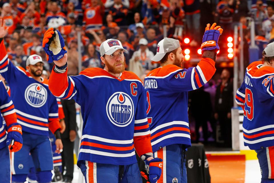 Edmonton forward Connor McDavid (97) celebrates with his teammates after the Oilers beat the Dallas Stars to win the NHL Western Conference Final.