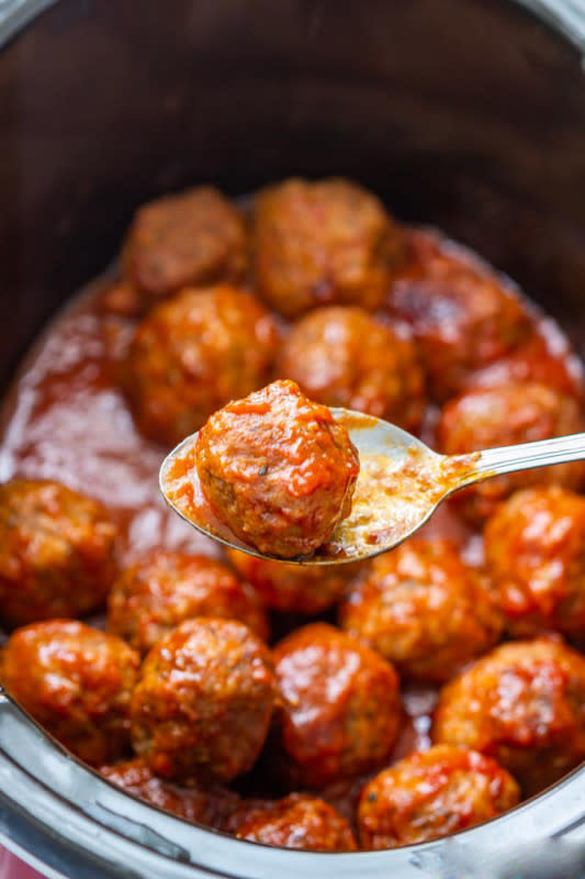 <p>Appetizer Addiction</p><p>Meatballs are guaranteed to always satisfy a crowd. </p><p><strong>Get the recipe:</strong><a href="https://www.appetizeraddiction.com/slow-cooker-sweet-and-spicy-meatballs/" rel="nofollow noopener" target="_blank" data-ylk="slk:Slow Cooker Sweet and Spicy Meatballs;elm:context_link;itc:0;sec:content-canvas" class="link "><strong> Slow Cooker Sweet and Spicy Meatballs</strong></a></p>