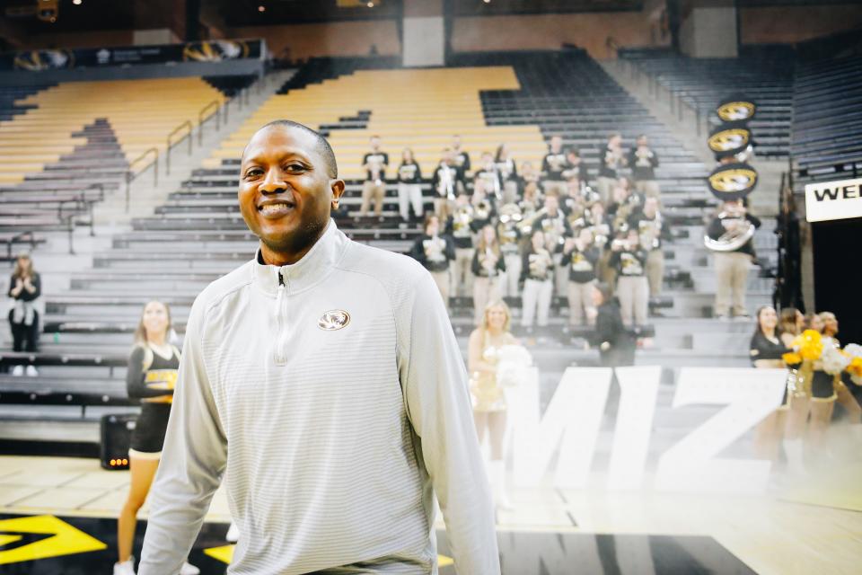 Missouri men's basketball head coach Dennis Gates walks onto the court as he is introduced during Missouri's NCAA Selection Show watch party on March 12, 2023, at Mizzou Arena.