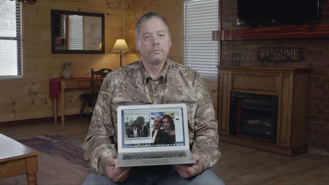 <p>courtesy netflix</p> Wayne Maines holding a photo of his daughter Nicole.