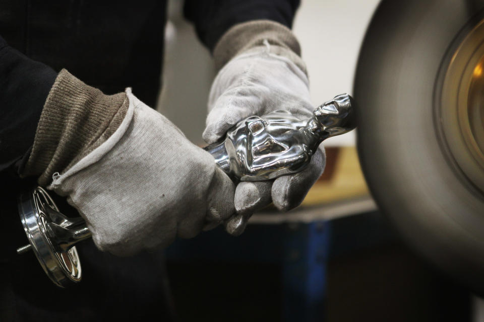 CHICAGO, IL - FEBRUARY 09: A worker polishes an Oscar statuette at R.S. Owens & Company February 9, 2012 in Chicago, Illinois. R.S. Owens manufactures the Oscar statuettes which are presented at the annual Academy Awards by the Academy of Motion Picture Arts and Sciences. After the theft of the statuettes prior to the 2000 Academy Awards the company began casting the statuettes one year in advance of the show. (Photo by Scott Olson/Getty Images)