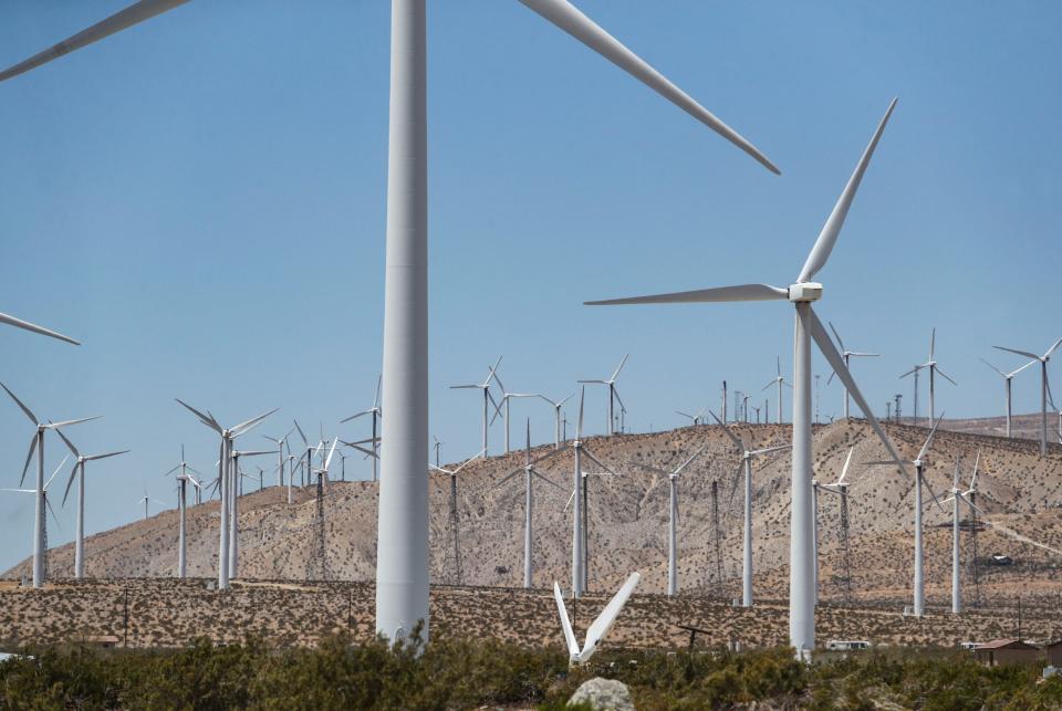 A variety of wind turbines are seen in the distance from Palm Springs Windmill Tours in Palm Springs, Calif., Wednesday, May 11, 2022.