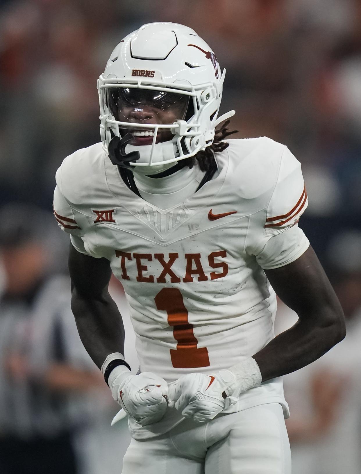 Texas wide receiver Xavier Worthy (1) celebrates a play in the first quarter of the Big 12 Conference Championship game at AT&T Stadium in Arlington, Texas, Saturday, Dec. 2, 2023