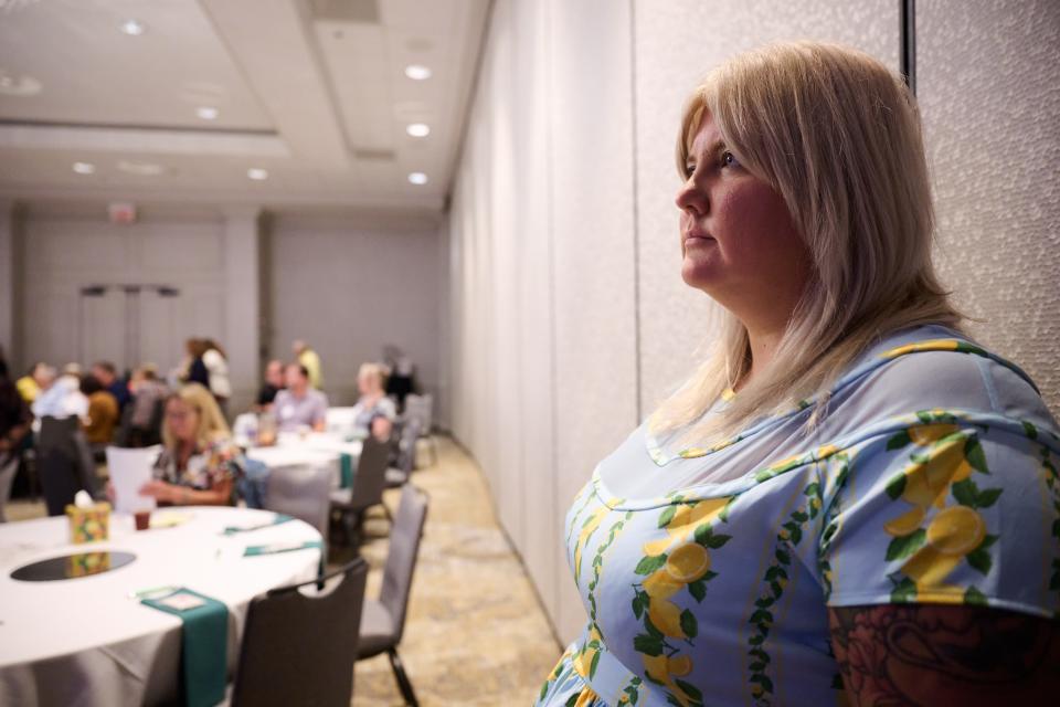 Lauren Hunter-Smith presents at a Family Wealth Group conference focused on handling grief on Aug. 11, 2023, at the Marriott Griffen Gate in Lexington, Ky. The Family Wealth Group is a financial planning and advising firm primarily focused on providing financial plans for retirees. Hunter-Smith’s presentation focused on her services as a "death doula."