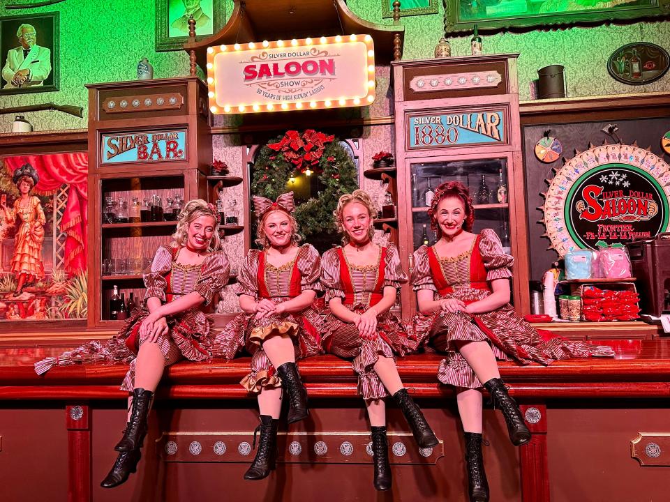 Women sitting on stage at saloon Silver Dollar City