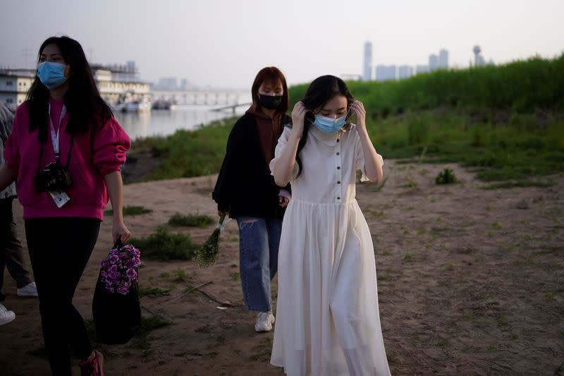 Peng Jing, 24, wearing a face mask during her wedding photography shoot after the lockdown was lifted in Wuhan