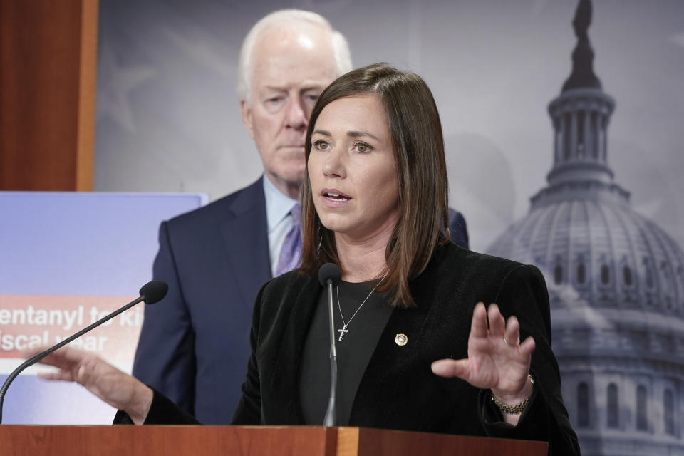 FILE - Sen. Katie Britt, R-Ala., speaks to the media during a news conference, Sept. 27, 2023, on Capitol Hill in Washington, as Sen. John Cornyn, R-Texas, left, looks on. Republican presidential candidates will gather in Alabama on Wednesday, Dec. 6, for the fourth GOP debate of the 2024 presidential campaign. Alabama's two U.S. senators represent two styles of Republican politics. Britt is a former head of the state chamber of commerce and chief of staff to retired Sen. Richard Shelby, the old-guard dealmaker first elected as a Democrat. Like her old boss, Britt operates more behind the scenes and campaigns generically on “conservative Alabama values.” (AP Photo/Mariam Zuhaib, File)