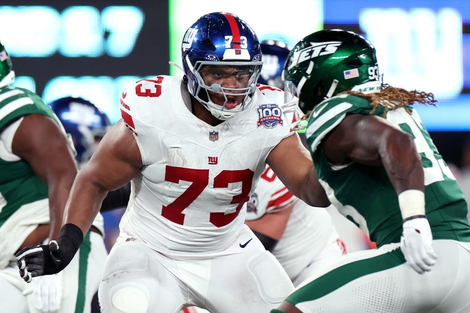 EAST RUTHERFORD, NEW JERSEY - AUGUST 24: Evan Neal #73 of the New York Giants blocks against the New York Jets during the second quarter of a preseason game at MetLife Stadium on August 24, 2024 in East Rutherford, New Jersey. (Photo by Luke Hales/Getty Images)