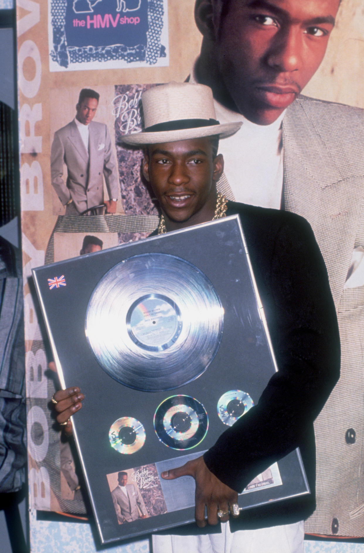 American R&B singer Bobby Brown holding a copy of his album 'Don't Be Cruel', at the HMV shop, circa 1988. (Photo by Dave Hogan/Hulton Archive/Getty Images)