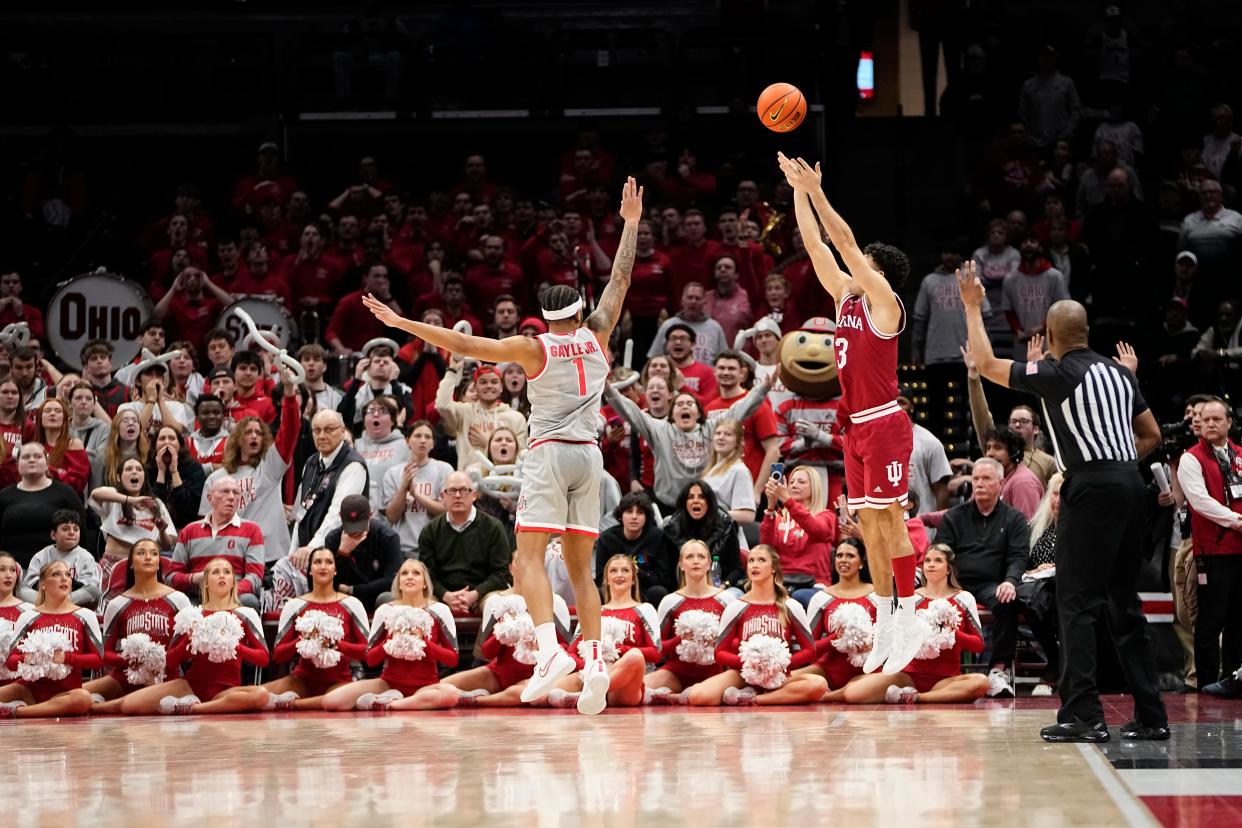 Feb 6, 2024; Columbus, Ohio, USA; Indiana Hoosiers guard Anthony Leal (3) hits the go-ahead three pointer over Ohio State Buckeyes guard Roddy Gayle Jr. (1) during the second half of the men’s basketball game at Value City Arena. Ohio State lost 76-73.