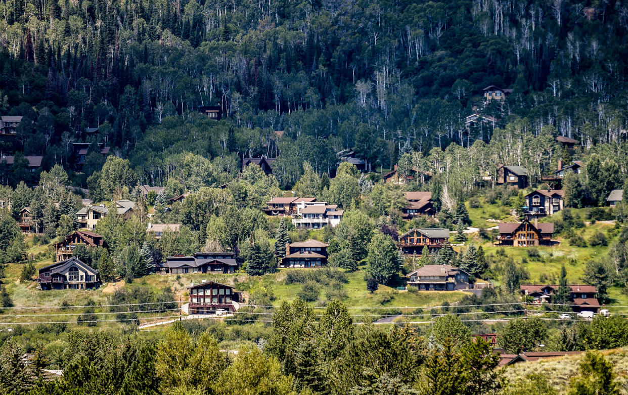 Houses dot a hillside in Steamboat Springs, Colo., (Thomas Peipert / AP file)