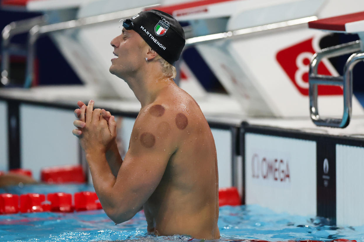 Nicolo Martinenghi of Team Italy celebrates after winning the men's 100m breaststroke final at the 2024 Paris Olympics.