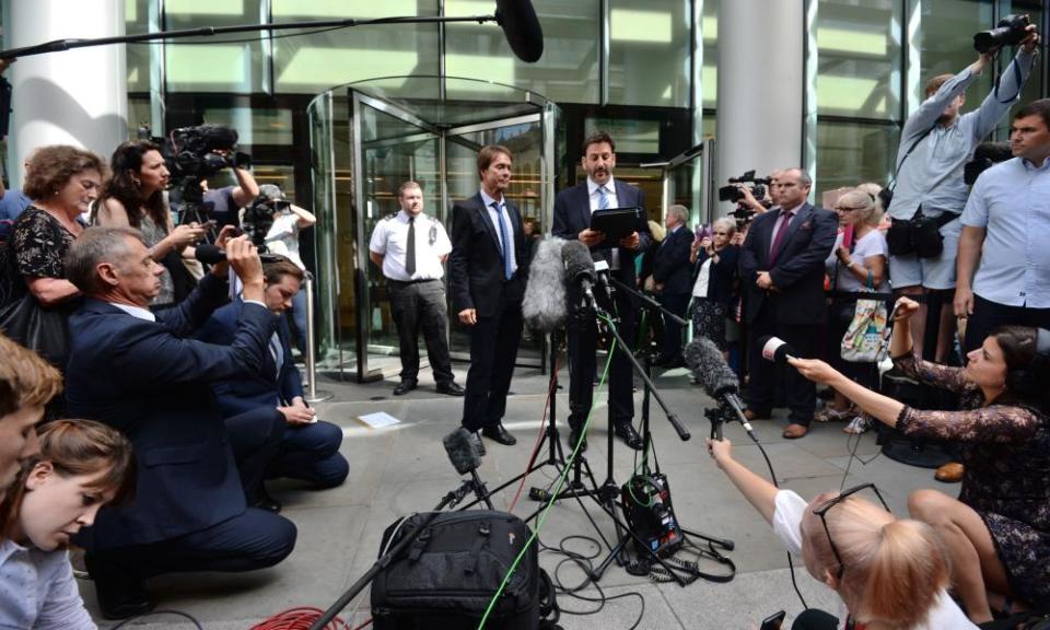 Sir Cliff Richard (centre) with his lawyer, Gideon Benaim, outside the Rolls Building in London.