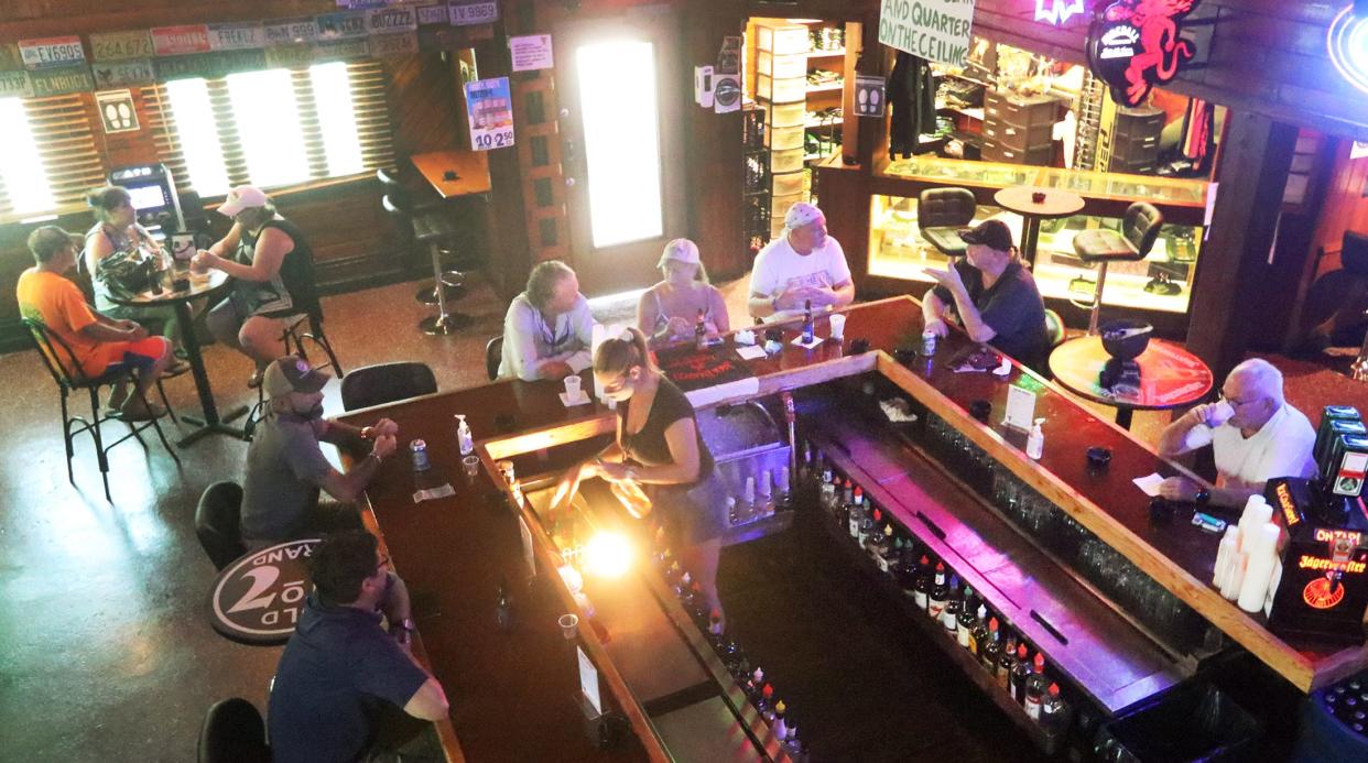 Some Daytona Beach bar owners say they have their own security systems that work for them, and they don't want the city telling them what to do. Pictured is Froggy's Saloon on Main Street in Daytona Beach.