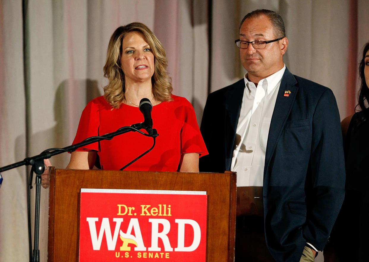 Arizona GOP senate candidate Kelli Ward, with husband Michael Ward by her side, concedes the primary in a speech to supporters at an election night event on August 28, 2018 in Scottsdale, Arizona. (Getty Images)