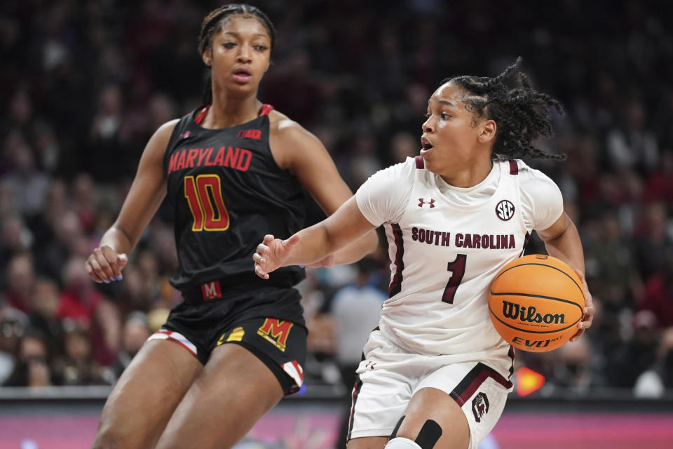 South Carolina guard Zia Cooke (1) dribbles the ball against Maryland forward Angel Reese (10) during the second half of an NCAA college basketball game Sunday, Dec. 12, 2021, in Columbia, S.C. (AP Photo/Sean Rayford)