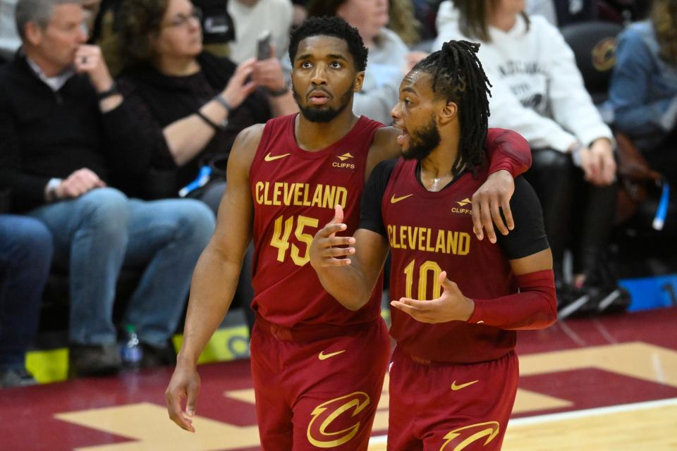 Apr 12, 2024; Cleveland, Ohio, USA; Cleveland Cavaliers guard Donovan Mitchell (45) and guard Darius Garland (10) talk in the fourth quarter against the Indiana Pacers at Rocket Mortgage FieldHouse. Mandatory Credit: David Richard-USA TODAY Sports