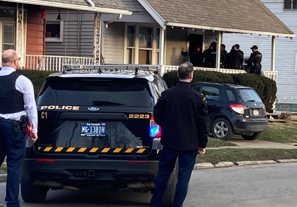 As they investigate a shooting in the area, Erie police converge on a house on Cherry Street, just south of West 29th Street and near Stafford Avenue, on Feb. 8, 2023.