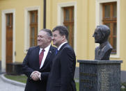 Slovakia Foreign Affairs Minister Miroslav Lajcak, right, welcomes US Secretary of State Mike Pompeo, during his visit to Bratislava, Slovakia, Tuesday, Feb. 12, 2019. Pompeo is in Slovakia on the second leg of a five-nation European tour that began in Hungary and will take him to Poland, Belgium and Iceland. (AP Photo/Petr David Josek)