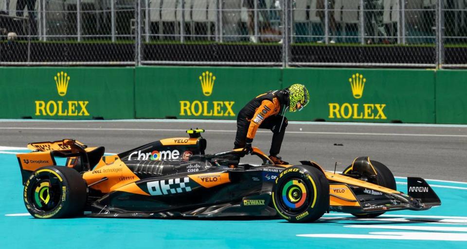 McLaren driver Lando Norris of Britain leaves his car after crashing during the Sprint race on the second day of the Formula One Miami Grand Prix