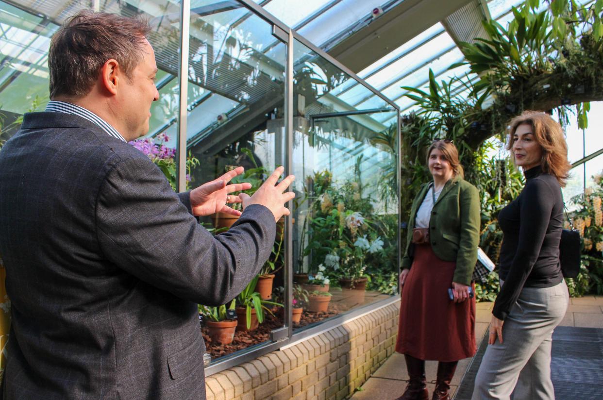 Project managers discuss the illegal plant trade at the Princess of Wales Conservatory in Kew Gardens.