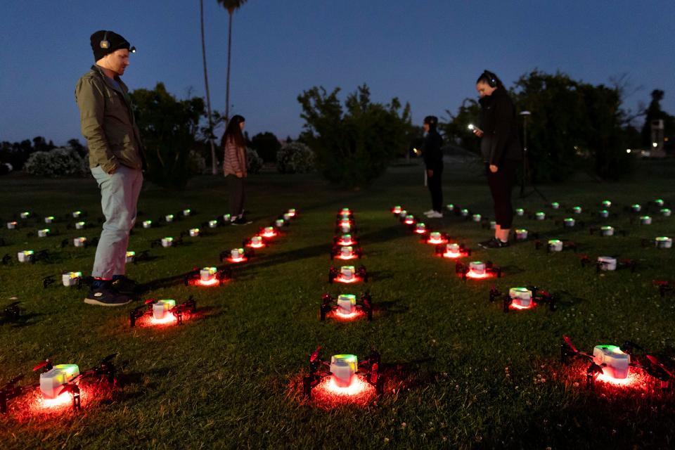 Crewmembers with Sky Elements Drone Shows do an “arms check” to ensure all of the 200 drones’ rotors are functioning properly prior to a drone show at the Alameda County Fair on June 26, 2024, in Pleasanton, Calif.