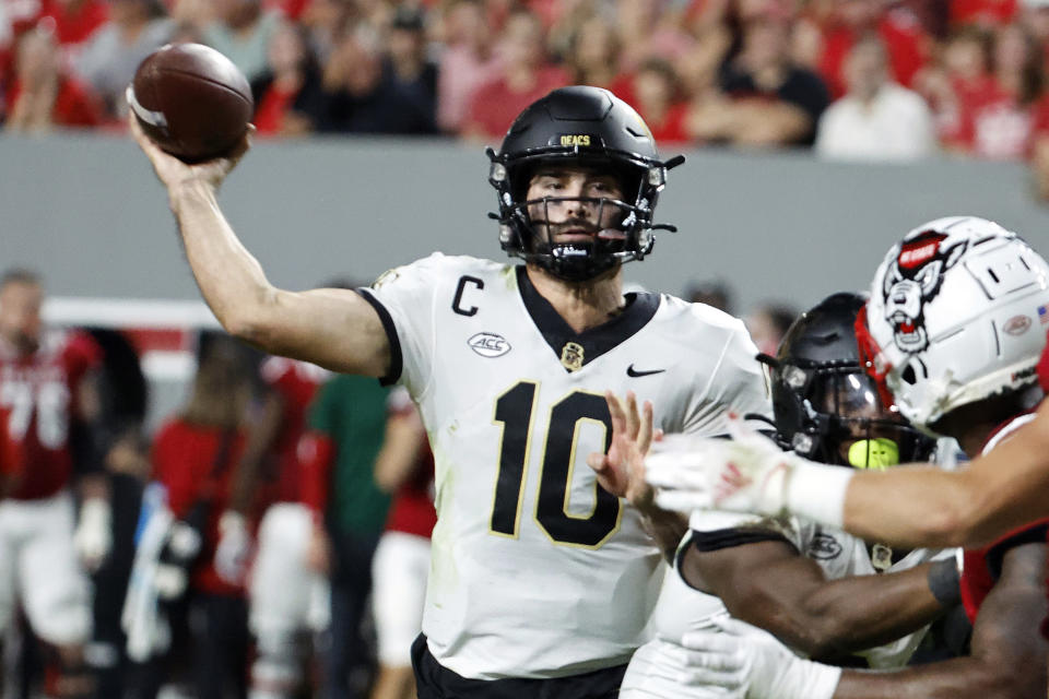 Wake Forest quarterback Sam Hartman (10) throws the ball during the first half of an NCAA college football game against North Carolina State in Raleigh, N.C., Saturday, Nov. 5, 2022. (AP Photo/Karl B DeBlaker)