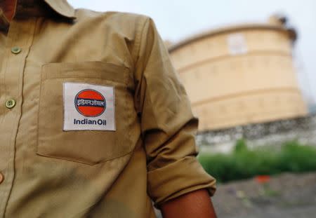 An Indian Oil tanker driver waits outside a fuel depot in Mumbai, October 6, 2017. REUTERS/ Danish Siddiqui/Files