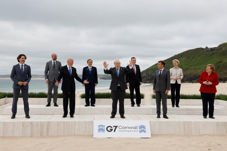 TOPSHOT - (L-R) Canada's Prime Minister Justin Trudeau, President of the European Council Charles Michel, US President Joe Biden, Japan's Prime Minister Yoshihide Suga, Britain's Prime Minister Boris Johnson, Italy's Prime minister Mario Draghi, France's President Emmanuel Macron, President of the European Commission Ursula von der Leyen and Germany's Chancellor Angela Merkel pose for the family photo at the start of the G7 summit in Carbis Bay, Cornwall on June 11, 2021. - G7 leaders from Canada, France, Germany, Italy, Japan, the UK and the United States meet this weekend for the first time in nearly two years, for three-day talks in Carbis Bay, Cornwall. (Photo by Ludovic MARIN / AFP) (Photo by LUDOVIC MARIN/AFP via Getty Images)