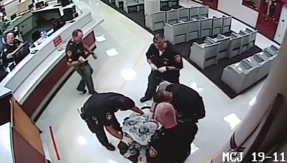 Wade was held down by at least four officers throughout the ordeal. Photo: Liveleak