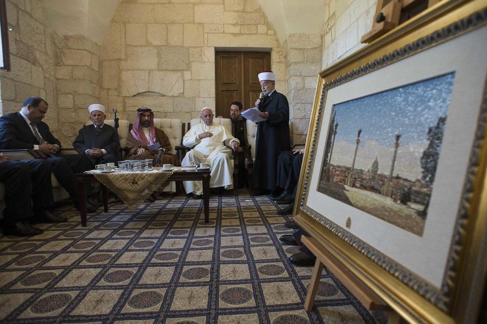 Pope Francis listens to Sheikh Mohammad Hussein, the Grand Mufti of Jerusalem, during a visit to the compound known to Muslims as Noble Sanctuary and to Jews as Temple Mount in Jerusalem's Old City