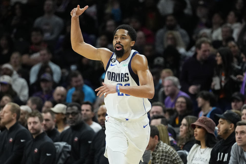 Dallas Mavericks guard Spencer Dinwiddie (26) celebrates a three pointer against the Phoenix Suns during the second half of an NBA basketball game, Thursday, Jan. 26, 2023, in Phoenix. (AP Photo/Matt York)