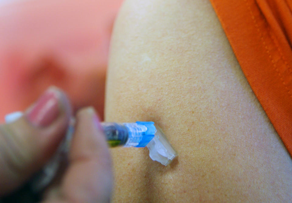 FILE - In this Monday, June 16, 2008 file photo, a patient receives a tetanus shot at the Work Well Clinic in Cedar Rapids, Iowa. According to a case study published Friday, March 8, 2019 by the U.S. Centers for Disease Control and Prevention, an unvaccinated 6-year-old Oregon boy was hospitalized for two months for tetanus and almost died of the bacterial illness after getting a deep laceration on his forehead while playing on a farm. (AP Photo/Seth Wenig)