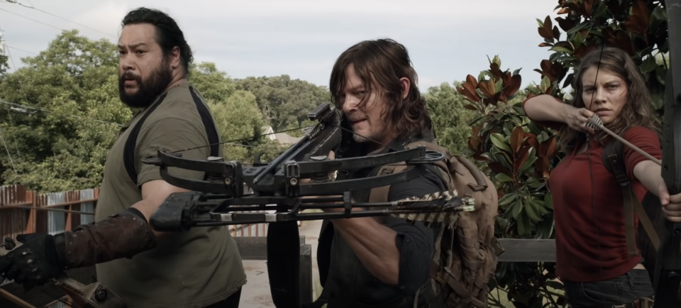 People holding weapons in "The Walking Dead"