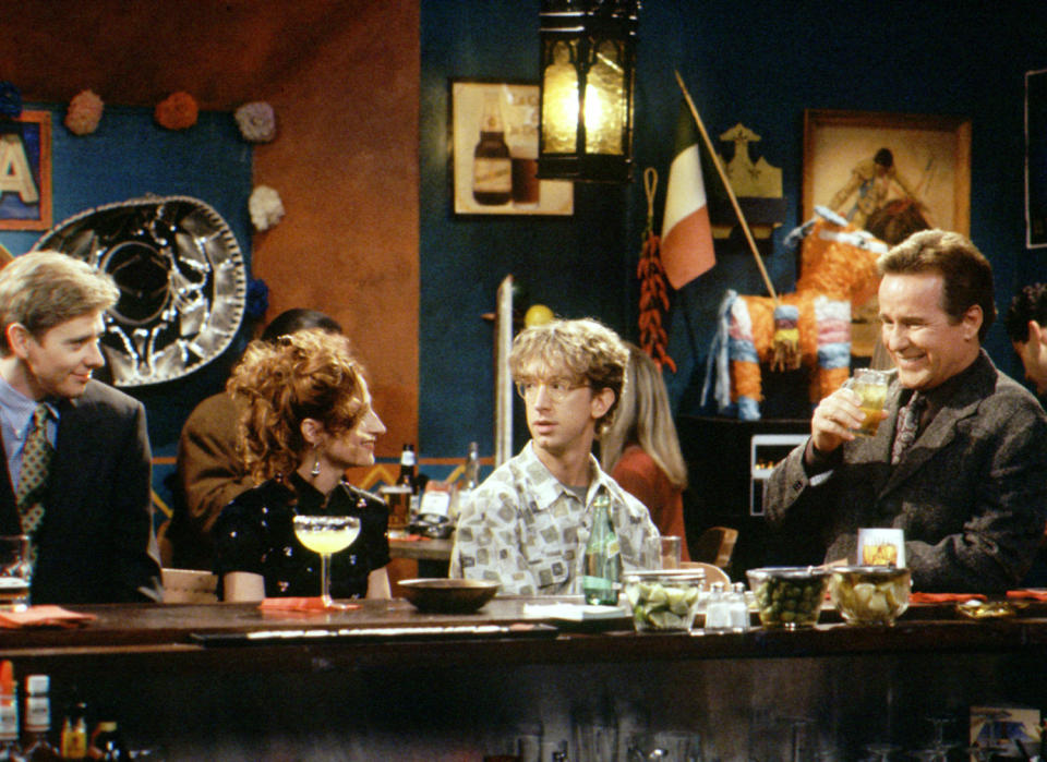 <p>Midway through the second season of NBC’s 1990s sitcom about staffers at AM radio station WNYX, something strange happened. British rock group Led Zeppelin started taking the episodes. The last nine episodes of <em>NewsRadio</em>’s second season are named after Led Zeppelin albums and songs, representing all the band’s studio albums. And in a random Zeppelin recurrence, an episode in Season 3 is named “Led Zeppelin Box Set.” While the titles don’t appear to have anything to do with the storyline for most of the episodes, it seems show creator Paul Simms was a fan of the legendary band and <a rel="nofollow noopener" href="http://www.nytimes.com/1995/04/09/arts/television-a-precocious-sitcom-freshman.html" target="_blank" data-ylk="slk:even wore;elm:context_link;itc:0;sec:content-canvas" class="link ">even wore</a> a Led Zeppelin T-shirt to his first interview with the <em>New York Times</em> to promote the launch of the series.<br><br>(Photo: Brillstein/Grey Entertainment/courtesy Everett Collection) </p>