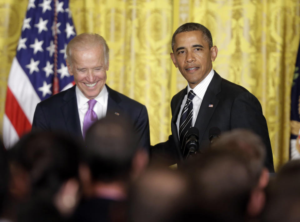 FILE - President Barack Obama, right, with Vice President Joe Biden on stage, speaks at a reception in the East Room of the White House in Washington to celebrate lesbian, gay, bisexual, and transgender (LGBT) Pride month, Washington, June 13, 2013. (AP Photo/Pablo Martinez Monsivais, File)