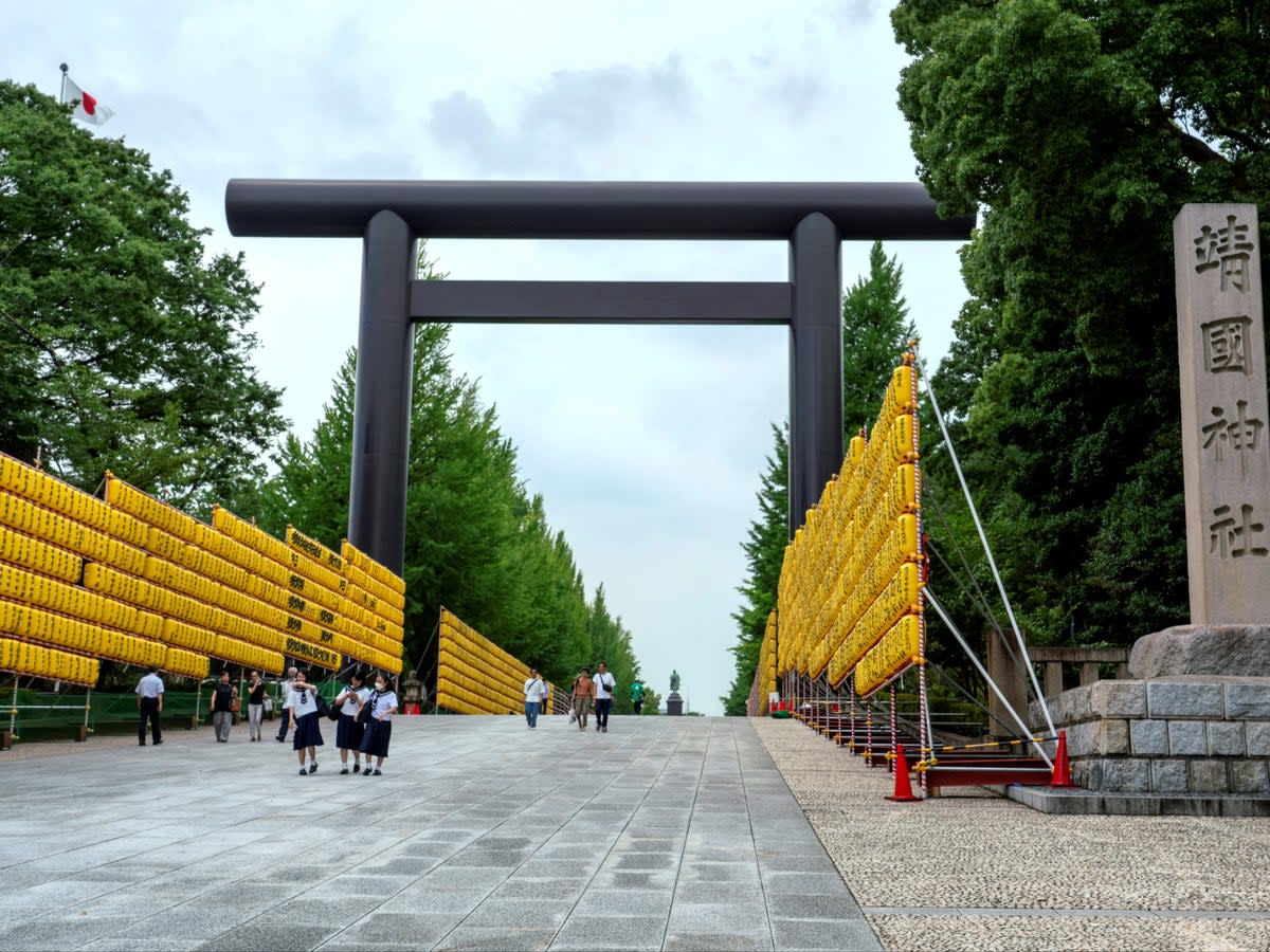 File: A stone pillar (R) at the Yasukuni Shrine is seen in Tokyo on 10 July 2024 (AFP via Getty Images)