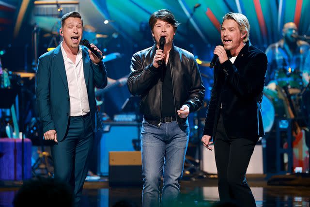 <p>Matt Winkelmeyer/Getty Images for The Recording Academy</p> Hanson performing during A Grammy Salute to the Beach Boys on Feb. 8, 2023, in Hollywood, California