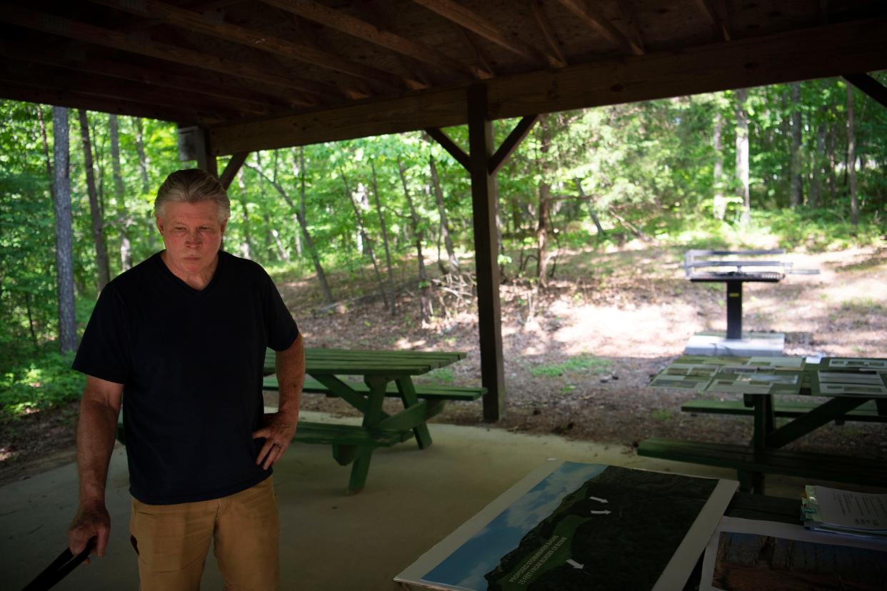 Tim Rocco looks at the posters depicting concerns from Loblolly Pine Alliance, a nonprofit formed in Fairview to advocate for "responsible and sustainable growth" at Bowie Nature Park in Fairview , Tenn., Thursday, May 12, 2022.