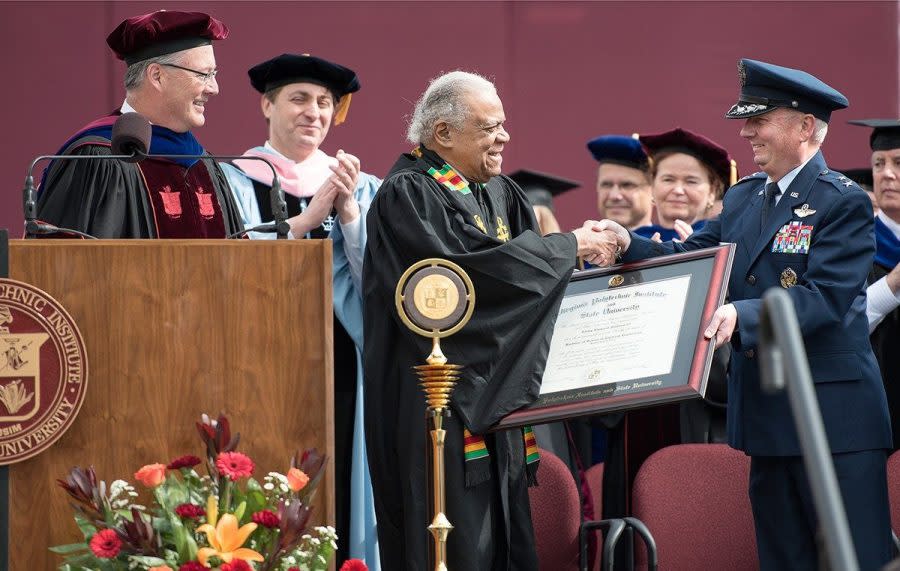 Peddrew, center, received an honorary degree from Virginia Tech at the 2016 University Commencement ceremony. (Photo by Logan Wallace for Virginia Tech.)