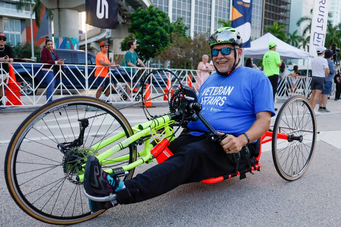 A hand cyclist from Veterans Affairs Miami reacts after finishing the Lexus Corporate Run in downtown Miami on Thursday, April 27, 2023. SAM NAVARRO/Special for the Miami Herald